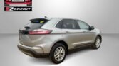 Promotional image showing a silver SUV with Easton Motors EZCredit branding and the slogan 'APPLY, ARRIVE & DRIVE!' on a light backdrop.