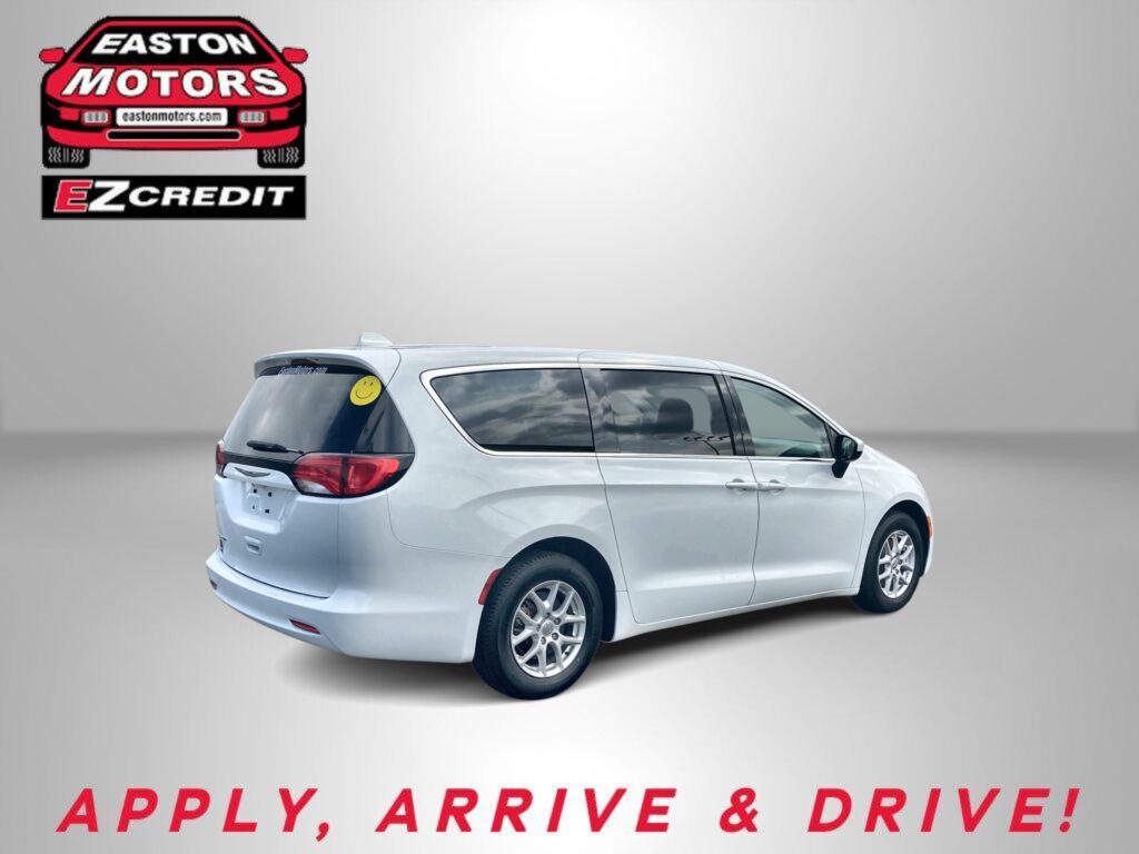 Advertisement banner featuring Easton Motors EZCredit logo with a red car graphic and a silver minivan, captioned 'APPLY, ARRIVE & DRIVE!' at the bottom.