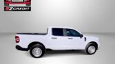 White pickup truck shown in a studio setting with Easton Motors EZ Credit logo in the top-left corner and a bold 'APPLY, ARRIVE & DRIVE' message beneath.