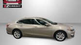Beige sedan shown in a studio with Easton Motors logo in the top-left corner and the slogan 'APPLY, ARRIVE & DRIVE!' at the bottom.