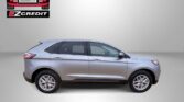 Side profile of a silver SUV with Easton Motors EZCredit logo in the top left and the slogan 'Apply, Arrive & Drive' below.