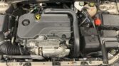 Under-hood view of a modern car engine with ECOTEC branding and orange coolant reservoir