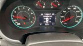 Dashboard cluster with tachometer on the left, speedometer on the right, and a central screen showing tire pressure readings and odometer (65881 miles). The fuel and engine temperature gauges are above. Includes partial steering wheel in view.