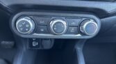Car climate control: three knobs—left for airflow mode, middle for fan speed (0–4), right for temperature (blue to red). A/C and recirculation buttons nearby appear.