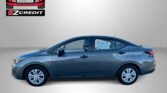 Blue sedan photographed indoors with an EZCredit logo at the top left and the slogan 'APPLY, ARRIVE & DRIVE!' in red text below.