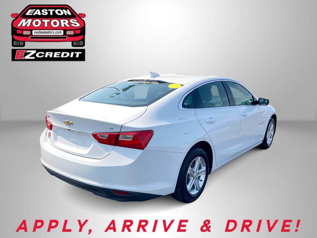 White Chevrolet sedan shown from rear three-quarter with dealership logos (Easton Motors, EZCredit) in a gray studio background; slogan 'APPLY, ARRIVE & DRIVE!' at bottom